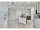 This open kitchen plan has gray cabinets, stainless appliances, and granite countertops at 31105 Mango Fade Way, San Antonio, FL 33576