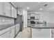 This kitchen features gray cabinets, stainless appliances, and granite countertops at 31105 Mango Fade Way, San Antonio, FL 33576