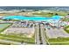 Aerial view of a neighborhood amenity lagoon and beach. Plenty of space for community recreation at 31105 Mango Fade Way, San Antonio, FL 33576