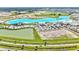 Aerial view of a neighborhood amenity lagoon. Plenty of space for community recreation at 31105 Mango Fade Way, San Antonio, FL 33576