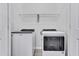 Convenient laundry room features new appliances, shelving and neutral paint at 31105 Mango Fade Way, San Antonio, FL 33576