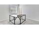 Bright home office with neutral walls, carpet floors, large window and door at 31105 Mango Fade Way, San Antonio, FL 33576