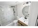 Updated bathroom featuring a stand-up shower with decorative tile and a modern vanity at 3232 Lake Pine E Way # A2, Tarpon Springs, FL 34688