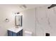 Bright bathroom with a vanity, marble tiled shower, and modern fixtures at 3232 Lake Pine E Way # A2, Tarpon Springs, FL 34688