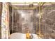 Bathroom features a tub with a full shower and gold fixtures at 3301 Haviland Ct # 301, Palm Harbor, FL 34684