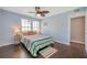 Cozy bedroom with wood floors, ceiling fan, and lots of natural light at 3301 Haviland Ct # 301, Palm Harbor, FL 34684