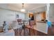 Cozy dining area with a modern light fixture and a view into the kitchen at 3301 Haviland Ct # 301, Palm Harbor, FL 34684