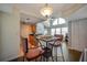 Bright dining area open to living room, featuring high ceilings and ample natural light at 3301 Haviland Ct # 301, Palm Harbor, FL 34684