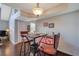 Dining area with modern bar stools and a view of the loft space at 3301 Haviland Ct # 301, Palm Harbor, FL 34684