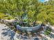 Community entrance to The Bentley is landscaped with a brick-paved sidewalk and stone retaining wall at 3301 Haviland Ct # 301, Palm Harbor, FL 34684