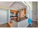 Bright kitchen with stainless steel appliances, granite countertops, and wood cabinetry at 3301 Haviland Ct # 301, Palm Harbor, FL 34684