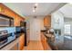 Spacious kitchen with stainless steel appliances and granite countertops at 3301 Haviland Ct # 301, Palm Harbor, FL 34684