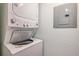 Image shows a stackable washer and dryer in a laundry area at 3301 Haviland Ct # 301, Palm Harbor, FL 34684