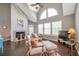 Cozy living room with vaulted ceilings, fireplace, large windows, and comfortable seating at 3301 Haviland Ct # 301, Palm Harbor, FL 34684