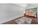 Open loft features hardwood floors, a colorful daybed and vaulted ceilings at 3301 Haviland Ct # 301, Palm Harbor, FL 34684