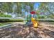 Community playground with play structure and slide at 3301 Haviland Ct # 301, Palm Harbor, FL 34684