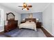Bedroom featuring classic wooden furniture and a neutral color scheme at 3500 Ballastone Dr, Land O Lakes, FL 34638