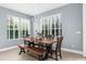 Dining area with bench seating and natural light from large windows at 3500 Ballastone Dr, Land O Lakes, FL 34638