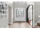 Welcoming foyer featuring elegant double doors, tile flooring, and neutral color palette at 3500 Ballastone Dr, Land O Lakes, FL 34638