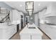 Bright, spacious kitchen featuring white cabinets and a large island at 3500 Ballastone Dr, Land O Lakes, FL 34638
