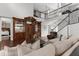 Spacious living room with a large entertainment center and staircase at 3500 Ballastone Dr, Land O Lakes, FL 34638