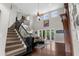Spacious living room with high ceilings, a staircase, and bright open floor plan at 3500 Ballastone Dr, Land O Lakes, FL 34638
