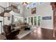 Spacious living room with high ceilings and access to the pool area at 3500 Ballastone Dr, Land O Lakes, FL 34638