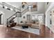 Bright living room with hardwood floors and views of the kitchen at 3500 Ballastone Dr, Land O Lakes, FL 34638