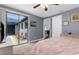 Bright main bedroom with a sliding glass door leading to a relaxing screened patio at 3500 Ballastone Dr, Land O Lakes, FL 34638