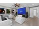 Inviting media room with plush seating, large screen, and entertainment setup for immersive viewing experience at 3500 Ballastone Dr, Land O Lakes, FL 34638