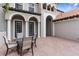 Cozy outdoor patio with brick flooring, seating, and classic architectural details at 3500 Ballastone Dr, Land O Lakes, FL 34638