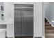 Modern stainless steel refrigerator complementing the kitchen cabinetry at 3500 Ballastone Dr, Land O Lakes, FL 34638