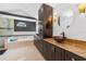 Elegant bathroom featuring granite countertops, modern fixtures, a soaking tub, and a glass-enclosed shower at 3509 Country Creek Ln, Valrico, FL 33596