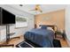 Bright bedroom with hardwood floors, a large window, and a comfortable queen bed at 3509 Country Creek Ln, Valrico, FL 33596