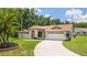 Beautiful single-story home with a well-manicured lawn and an attached two-car garage at 3509 Country Creek Ln, Valrico, FL 33596