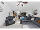 Open-concept living room and kitchen with a comfortable sectional sofa and stainless appliances at 3509 Country Creek Ln, Valrico, FL 33596