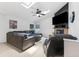Cozy living room with a comfortable sectional sofa, fireplace, and a flat-screen television at 3509 Country Creek Ln, Valrico, FL 33596