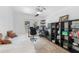 Functional home office with a daybed, ample storage, and direct access to the outdoors through French doors at 3509 Country Creek Ln, Valrico, FL 33596