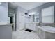 Spacious bathroom with a soaking tub, walk-in closet, and double vanity at 3603 Arbor Chase Dr, Palm Harbor, FL 34683