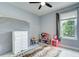 Bedroom with a dresser, rug, closet, and a window at 3603 Arbor Chase Dr, Palm Harbor, FL 34683