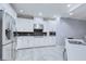 Well-appointed kitchen featuring stainless steel appliances and stylish black tile backsplash at 3603 Arbor Chase Dr, Palm Harbor, FL 34683