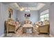 Living room with decorative chandelier, tile flooring, large window for natural light, and neutral wall color at 3603 Arbor Chase Dr, Palm Harbor, FL 34683
