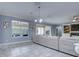 Open-concept living area featuring neutral tones, recessed lighting and a large window at 3603 Arbor Chase Dr, Palm Harbor, FL 34683