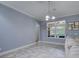 Bright living room with ample natural light and a view to the arched doorway at 3603 Arbor Chase Dr, Palm Harbor, FL 34683