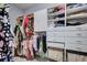 Walk-in closet with custom shelving and ample storage space for clothes and accessories at 3603 Arbor Chase Dr, Palm Harbor, FL 34683