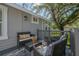 Relax on the back patio with stylish furniture, perfect for enjoying the outdoors at 3811 N Arlington Ave, Tampa, FL 33603