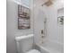 Cozy bathroom with white subway tile, a shower/tub, and gold accents, offering a luxurious feel at 3811 N Arlington Ave, Tampa, FL 33603