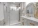 Bright bathroom with a glass shower, white marble countertops, and gold fixtures for a luxurious feel at 3811 N Arlington Ave, Tampa, FL 33603