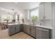 Well-lit kitchen with modern appliances, sleek cabinets, and views of the dining area at 3811 N Arlington Ave, Tampa, FL 33603