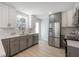 Bright kitchen with stainless steel appliances and herringbone tile backsplash at 3811 N Arlington Ave, Tampa, FL 33603